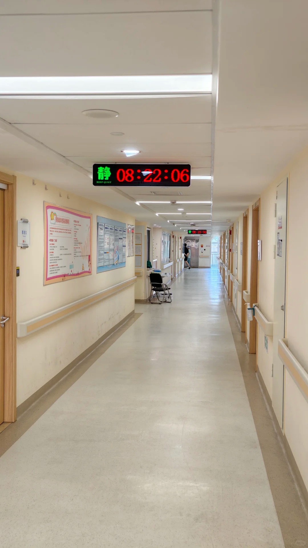 Wide hospital corridor with natural light from end window at Beijing Boren Hospital